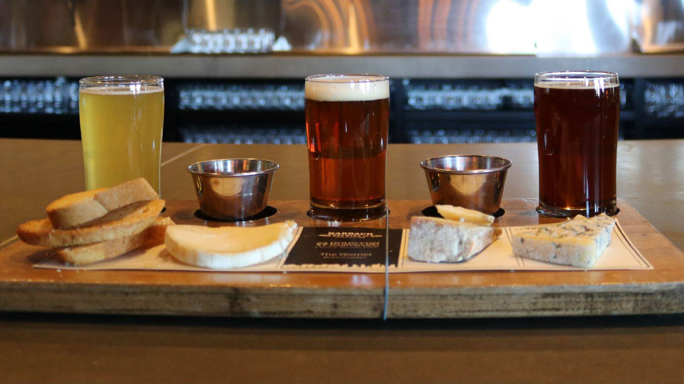 Drinks and food on a bar top